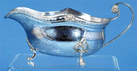 A George V Arts & Crafts silver sauce boat, by Albert Edward Jones, length 185mm, weight 7.3oz/228grms.